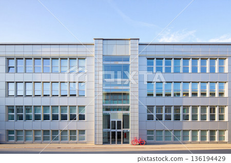 exterior of office building with glass window 136194429