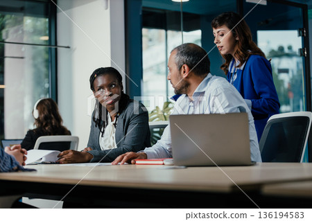 Multicultural business people collaborating during office meeting 136194583