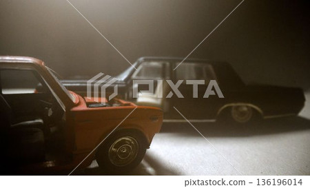 Miniature red and black toy cars in smoke Miniature red and black toy cars in smoke 136196014