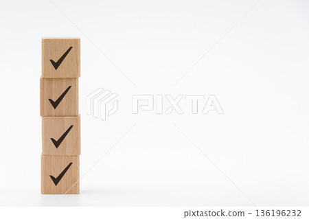 Image of stacked ✔️s, wooden checkmark blocks and white space Image of stacked ✔️s, wooden checkmark blocks and white space 136196232