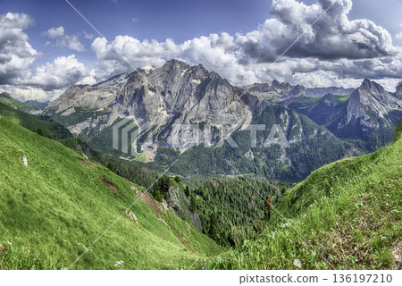 Marmolada mountain range towering over green valley, Dolomites, Italy 136197210
