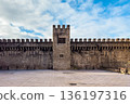 View of the ancient medieval walls of Vitoria-Gasteiz, featuring stone battlements and a central 136197316