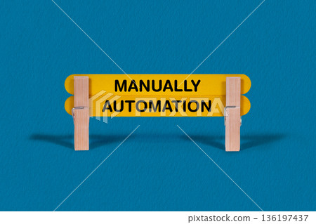 Concept words Manually , Automation , Double Light Yellow Wooden Stick Clothespin Blue Background , Artificial intelligence and Manually , Automation Theme Concept words Manually , Automation , Double Light Yellow Wooden Stick Clothespin Blue Background , Artificial intelligence and Manually , Automation Theme 136197437