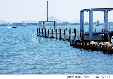A quiet lakeside dock - the blue and structural beauty of Lake Biwa 136197573
