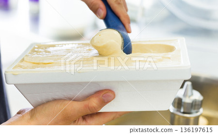 Vanilla ice cream in thermal insulation packaging at factory 136197615