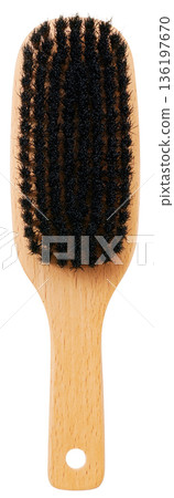 A wooden hairbrush made of natural bristles (pig bristles) cut out on a white background 136197670