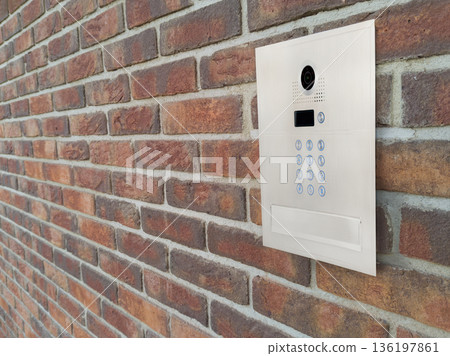 Modern Video Intercom Mounted on Brick Wall Modern Video Intercom Mounted on Brick Wall 136197861