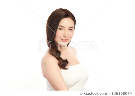 A beautiful young Asian woman with clean, fresh skin against a white background. Skincare, facial treatment, cosmetology, beauty, and spa. An elegant portrait of an Asian woman. A beautiful young Asian woman with clean, fresh skin against a white background. Skincare, facial treatment, cosmetology, beauty, and spa. An elegant portrait of an Asian woman. 136198074