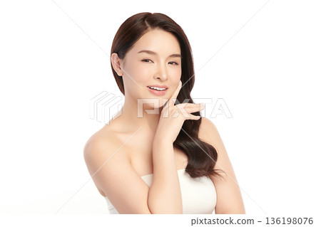 A beautiful young Asian woman with clean, fresh skin against a white background. Skincare, facial treatment, cosmetology, beauty, and spa. An elegant portrait of an Asian woman. A beautiful young Asian woman with clean, fresh skin against a white background. Skincare, facial treatment, cosmetology, beauty, and spa. An elegant portrait of an Asian woman. 136198076