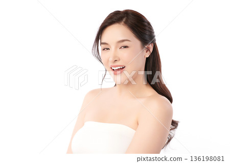 A beautiful young Asian woman with clean, fresh skin against a white background. Skincare, facial treatment, cosmetology, beauty, and spa. An elegant portrait of an Asian woman. A beautiful young Asian woman with clean, fresh skin against a white background. Skincare, facial treatment, cosmetology, beauty, and spa. An elegant portrait of an Asian woman. 136198081
