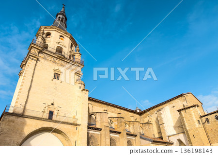Low-angle view of Santa Maria Cathedral in Vitoria-Gasteiz, showing its stone bell tower, Gothic Low-angle view of Santa Maria Cathedral in Vitoria-Gasteiz, showing its stone bell tower, Gothic 136198143