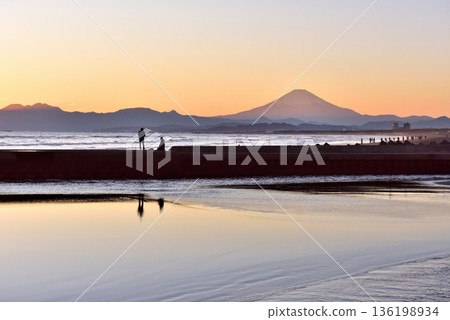 A person fishing at the sunset on Kugenuma Beach in Shonan A person fishing at the sunset on Kugenuma Beach in Shonan 136198934