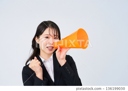 A young businesswoman posing in support A young businesswoman posing in support 136199030