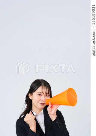 A young businesswoman posing in support A young businesswoman posing in support 136199031