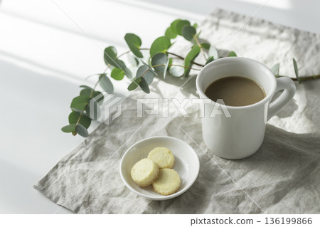 Morning cafe time in natural light (coffee and cookies, eucalyptus and linen) Morning cafe time in natural light (coffee and cookies, eucalyptus and linen) 136199866