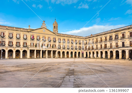 Wide view of Spain square in Vitoria-Gasteiz, featuring neoclassical arcaded facades, balconies and Wide view of Spain square in Vitoria-Gasteiz, featuring neoclassical arcaded facades, balconies and 136199907