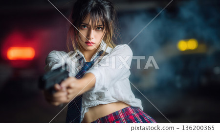 young Asian girl holding a pistol gun 136200365
