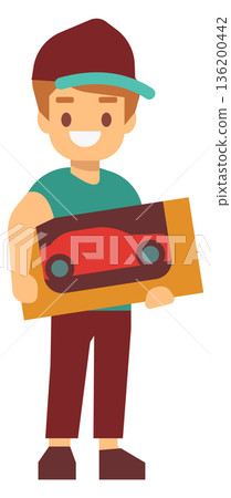 A young man is holding a toy car in his hand 136200442