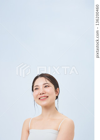 Young woman in a camisole Young woman in a camisole 136200460
