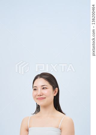 Young woman in a camisole 136200464