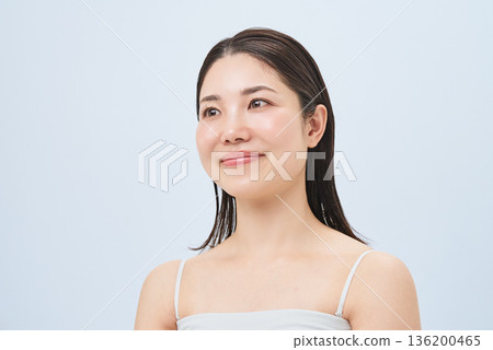 Young woman in a camisole Young woman in a camisole 136200465