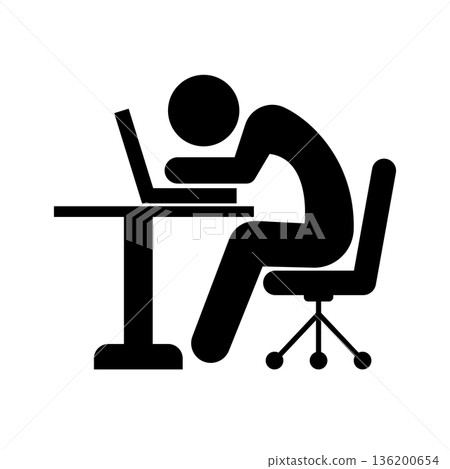 Silhouette of a person concentrating on working on a computer 136200654