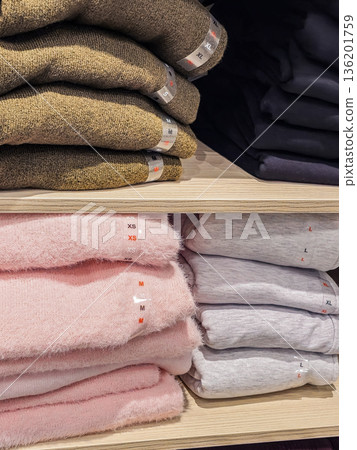 Pastel Sweaters Folded on Store Shelf Vertical Pastel Sweaters Folded on Store Shelf Vertical 136201759