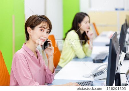 Female employee doing desk work in the office Female employee doing desk work in the office 136201803