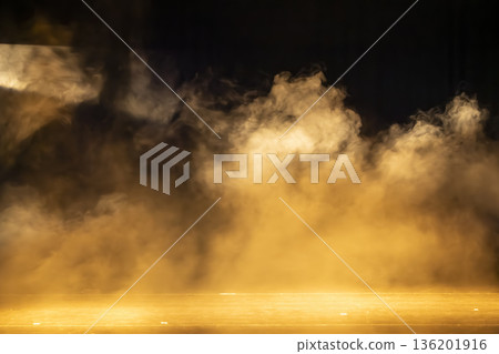 Golden smoke on stage creating warm atmosphere 136201916
