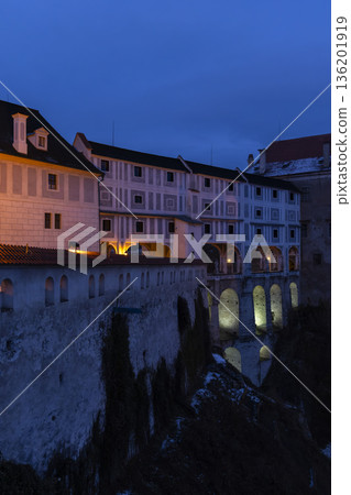 Cesky Krumlov Castle architecture at twilight, medieval bridge 136201919