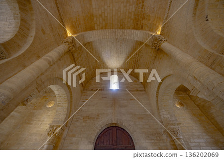 Romanesque church interior with arched ceiling and stone columns Romanesque church interior with arched ceiling and stone columns 136202069