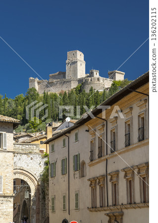 Rocca Maggiore fortress dominating Assisi cityscape in Umbria, Italy 136202115