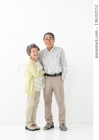 Friendly senior couple vertical 136202552