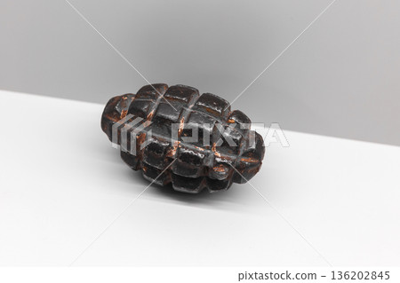 Soviet F-1 hand grenade is on white shelf Soviet F-1 hand grenade is on white shelf 136202845