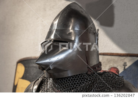 A medieval knight helmet with sharp nose 136202847