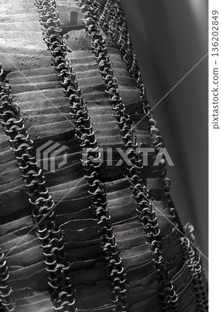 An ancient chain mail with steel rings and plates 136202849