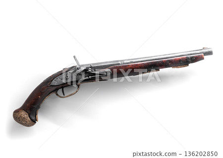 A classic historic flintlock pistol isolated on white 136202850