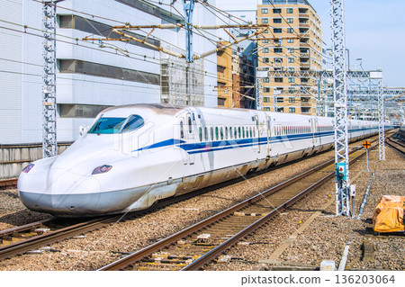 Yokohama cityscape in Japan: Inbound tourism continues...View of the Shinkansen in front of Shin-Yokohama Station and Yokohama Prince Hotel (left). 136203064