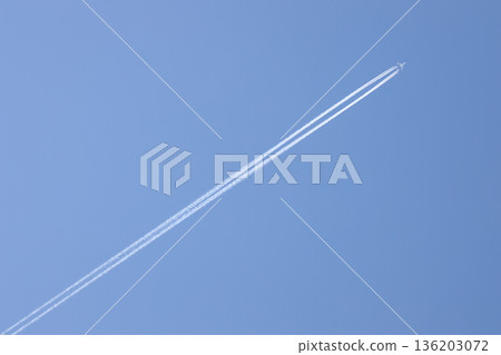 Airplane flying blue sky 136203072