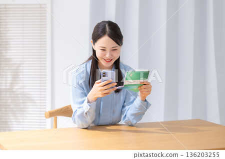 A woman with a smartphone A woman with a smartphone 136203255