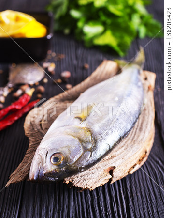Gray Mullet Fish (Kefal) with spice on board Gray Mullet Fish (Kefal) with spice on board 136203423