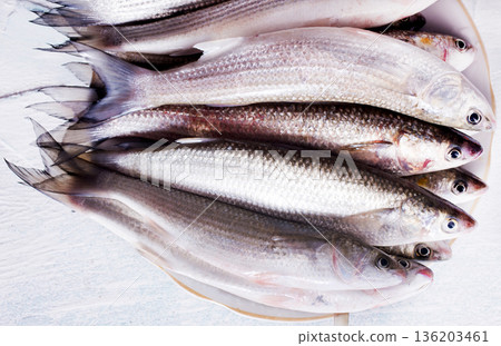 raw fish with spice on plate and on light table 136203461