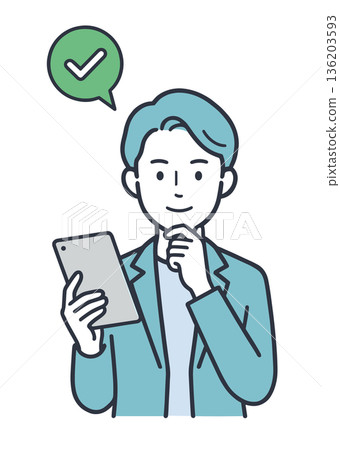圖示：一位男性商務人士正在平板電腦上進行批准和確認。 136203593