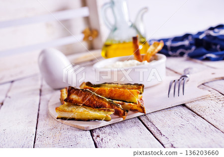 Baked crispy eggplant sticks served with white sauce. Vegetarian healthy dish. 136203660