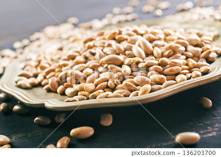 Raw Beans background, white beans on a table 136203700