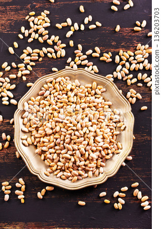 Raw Beans background, white beans on a table Raw Beans background, white beans on a table 136203703