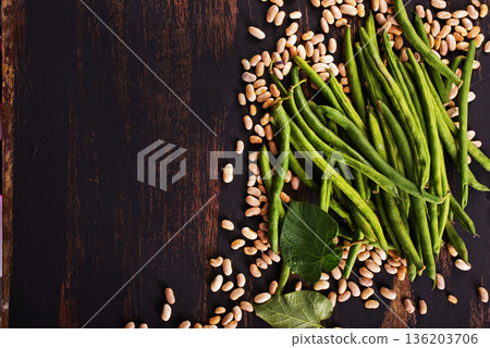 Common bean on darkj table with leaf 136203706