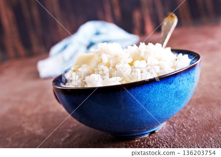 Delicious boiled rice in bowl on kitchen table 136203754