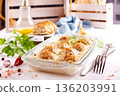Italian casserole of baked meatballs in spicy white sauce with mozzarella cheese 136203991