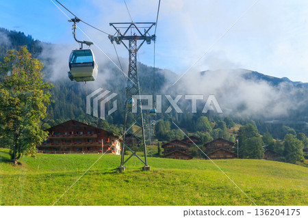Overhead cable car to First mountain, Grindelwald, Switzerland Overhead cable car to First mountain, Grindelwald, Switzerland 136204175
